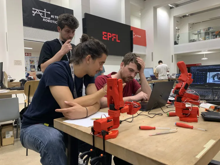 RoboHack table setup with two small robot arms
